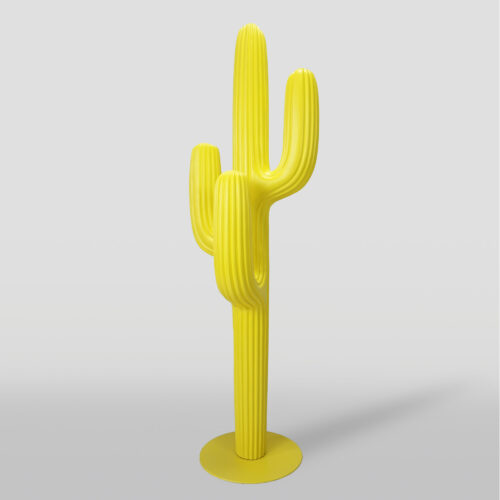 Yellow cactus-shaped sculpture on a grey background.