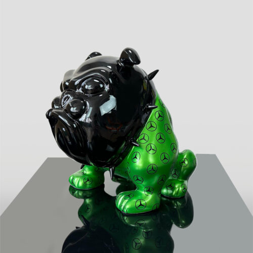 Black and green ceramic bulldog statue with spikes and Mercedes-Benz logos on its body.