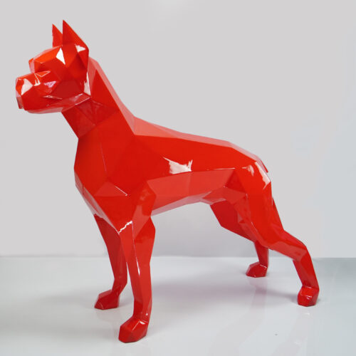 Red geometric dog sculpture on a light gray background.