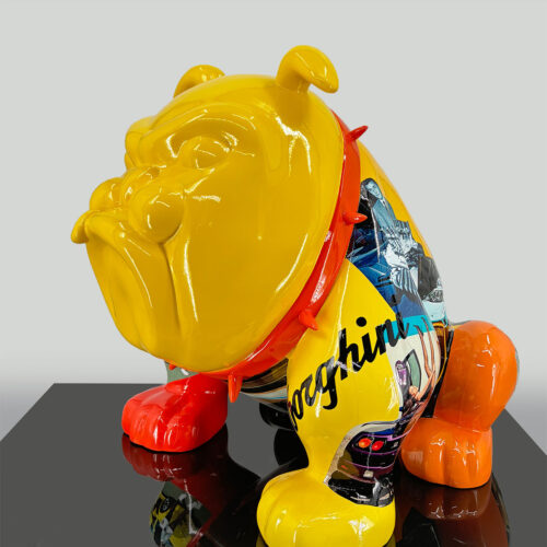 Yellow and orange bulldog sculpture with a glossy finish, featuring collage images and text on its body.