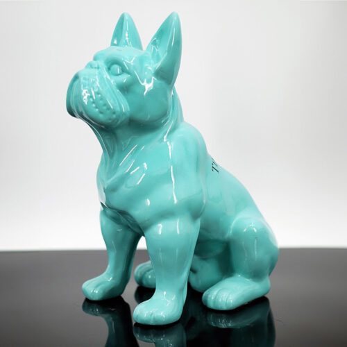Turquoise ceramic sculpture of a sitting French Bulldog.