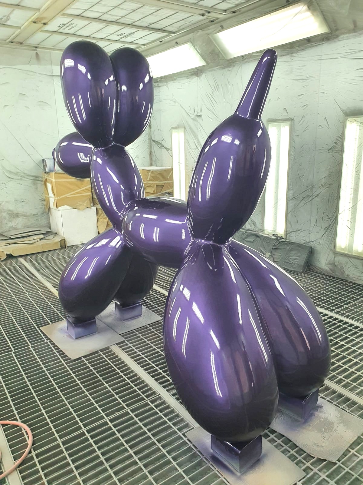 Large Decorative Figure Balloon Dog - Metallic Purple 4 Large purple balloon dog sculpture in a workshop.