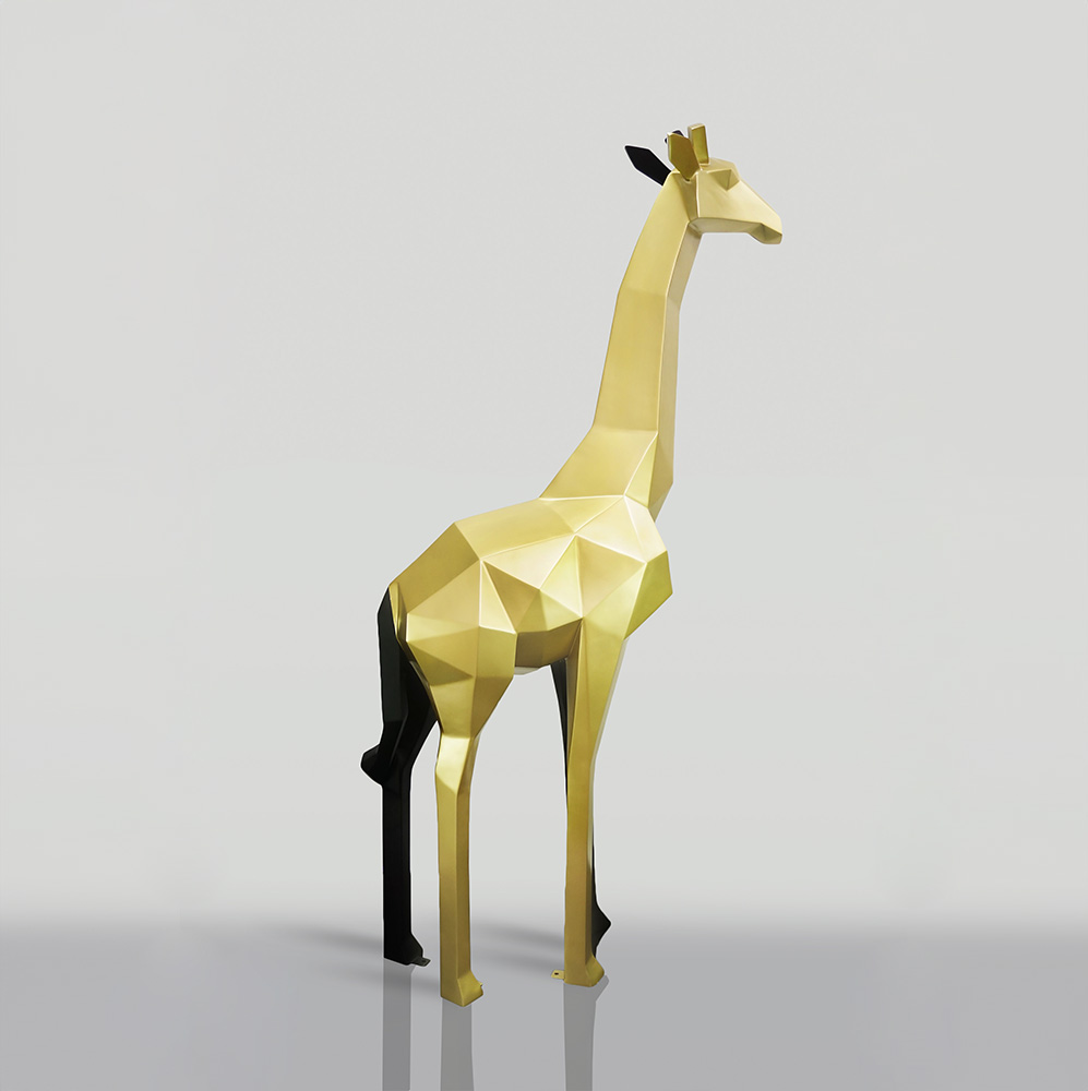 Large Geometric Giraffe Figure Made of Laminate - Gold/Black 3 Gold geometric giraffe sculpture on a light gray background.