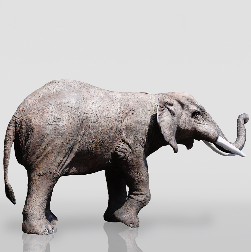 3D Figure - Life-Size Elephant 4 Side view of a woolly mammoth statue.