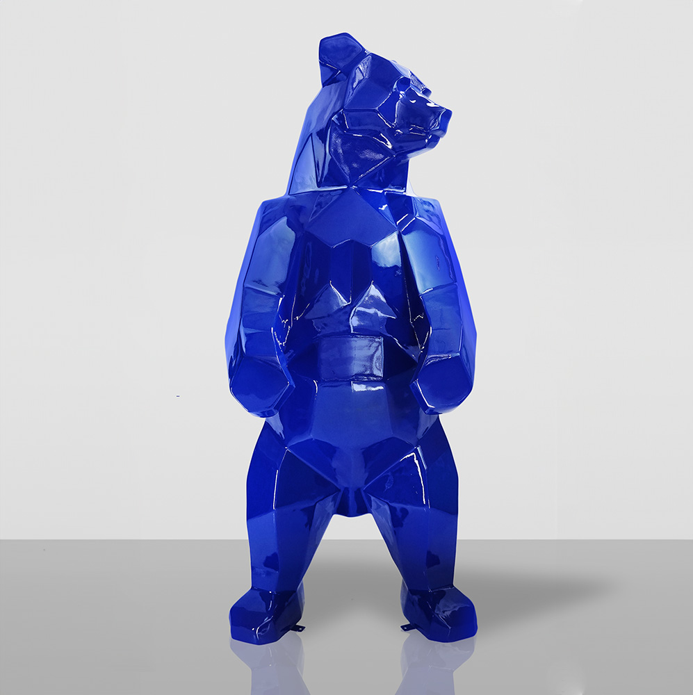 Large Bear Figure Square - Blue 1 Blue geometric bear sculpture standing on a reflective surface.