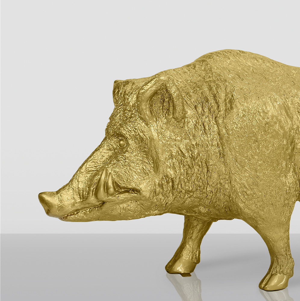 Life-Size Golden Wild Boar 1 Golden wild boar statue on a reflective surface.
