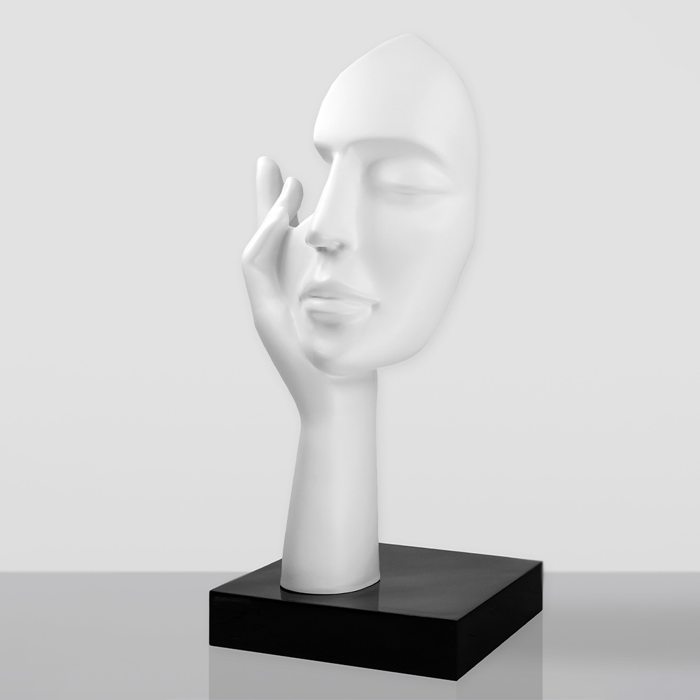 Medium-Sized 120CM Blue Mask on Stand - Golden Trash 2 White sculpture of a serene human face resting gently on a raised hand, mounted on a black rectangular base against a plain light gray background