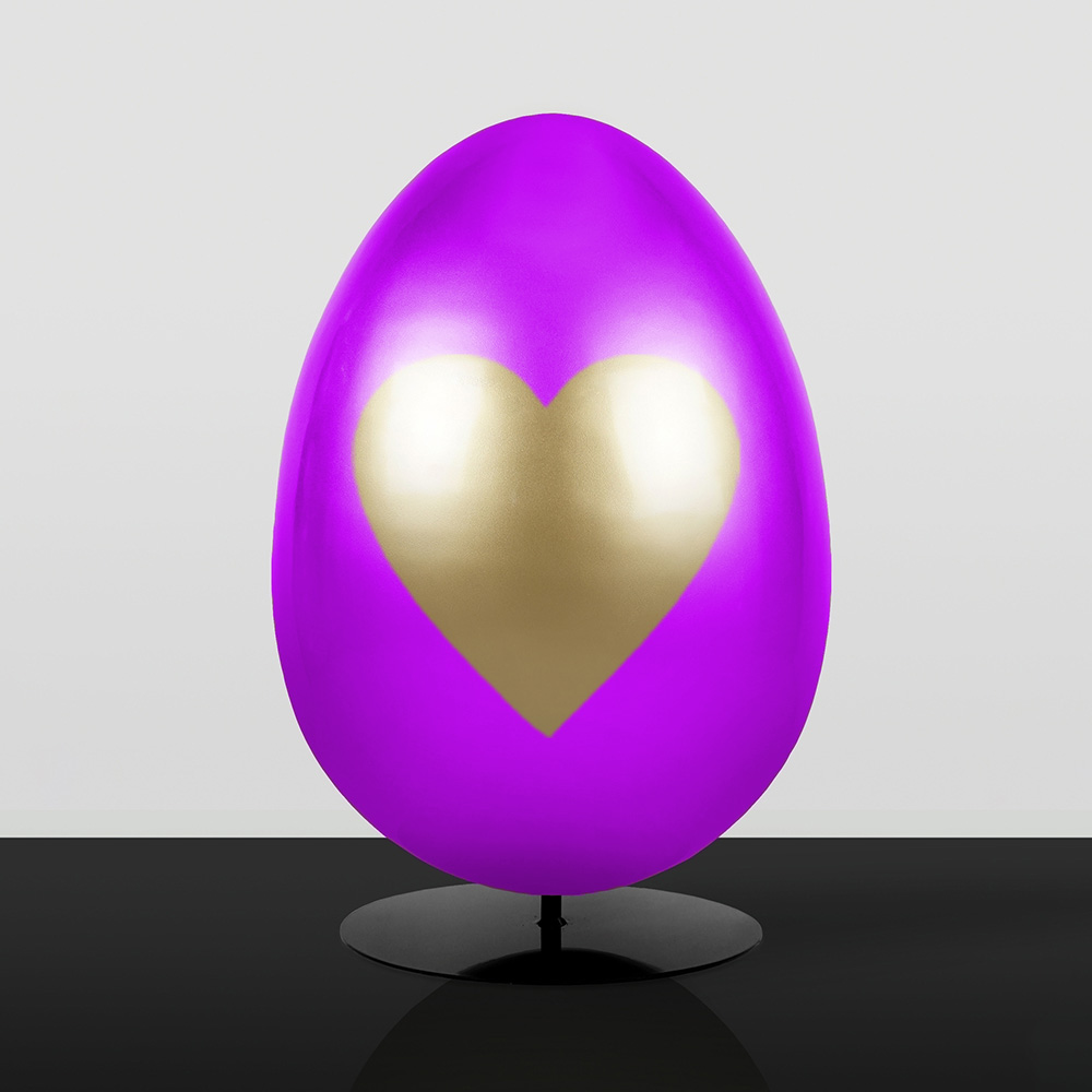 Decoration Large Easter Egg 3D Figure 1 Purple egg-shaped sculpture with a large golden heart on the front, displayed on a black circular stand against a light gray background.