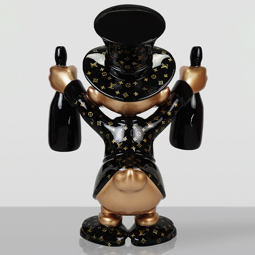 Decorative Figurine – Small Scrooge McDuck 3 Sculpture of a stylized character wearing a glossy black and gold Louis Vuitton-patterned outfit and top hat, holding two black bottles, shown from the back with a gold-colored tail and feet, against a plain gray background.