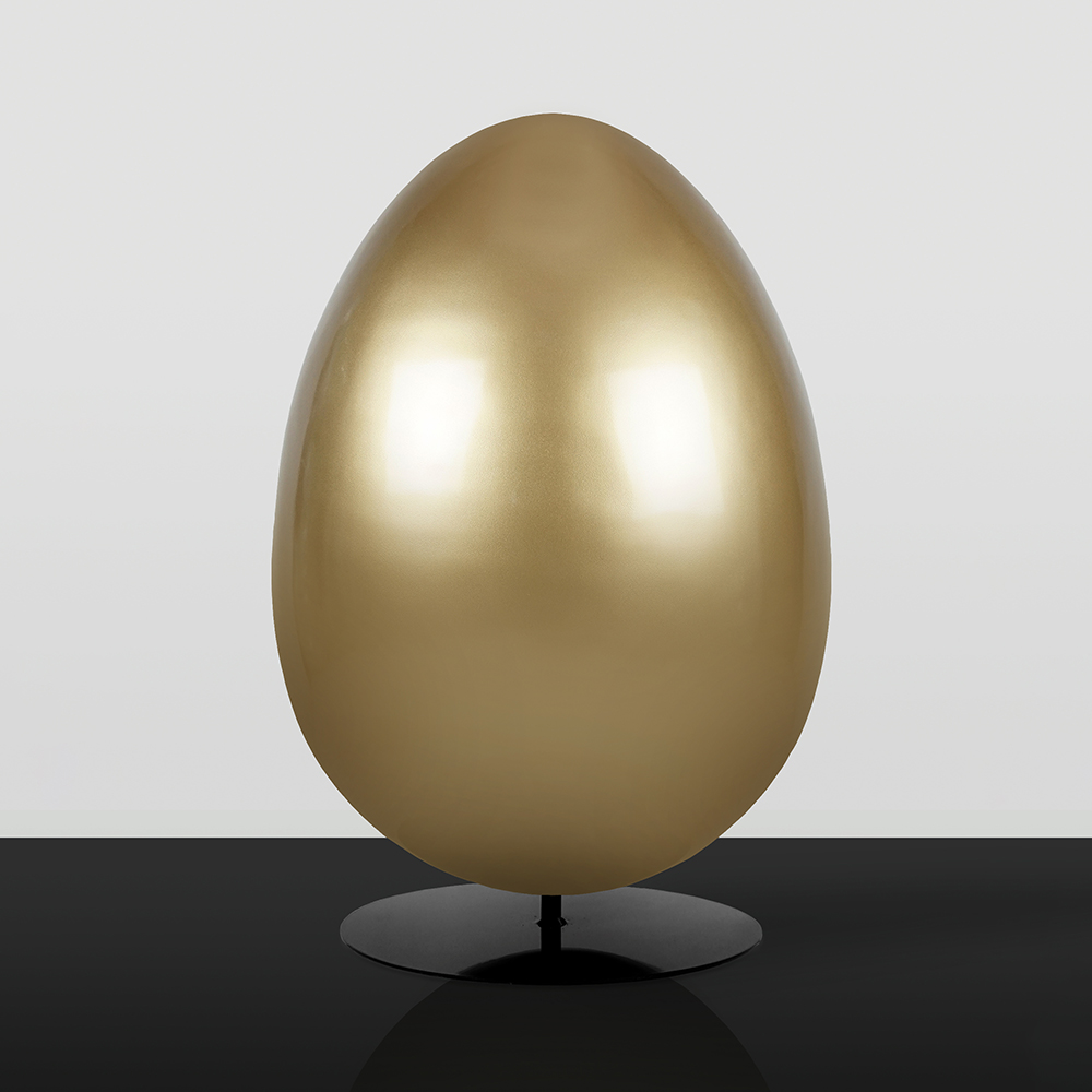 Golden Easter Eggs - Festive Decoration 1 Large smooth golden egg sculpture displayed on a black reflective surface against a light gray background
