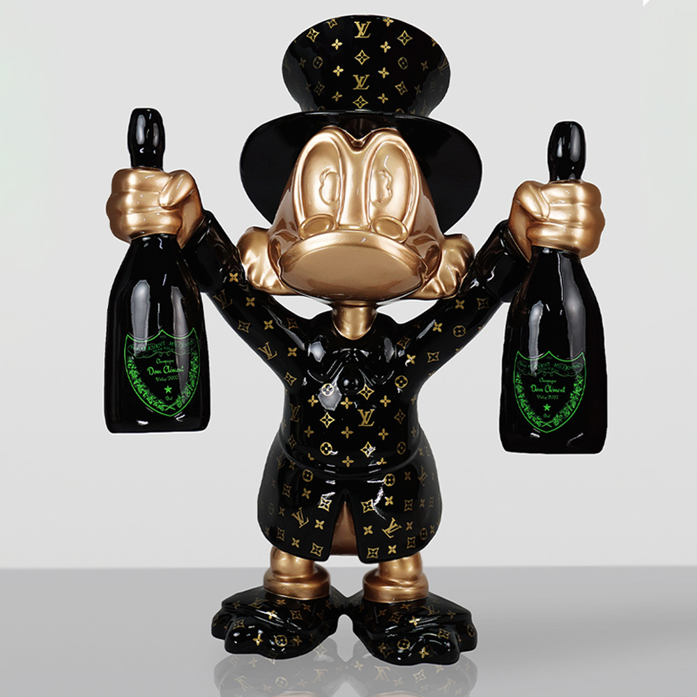 Decorative Figurine – Small Scrooge McDuck 1 Glossy black and gold sculpture of a cartoon duck character wearing a Louis Vuitton patterned suit and top hat, holding a bottle of champagne in each hand against a plain light gray background.