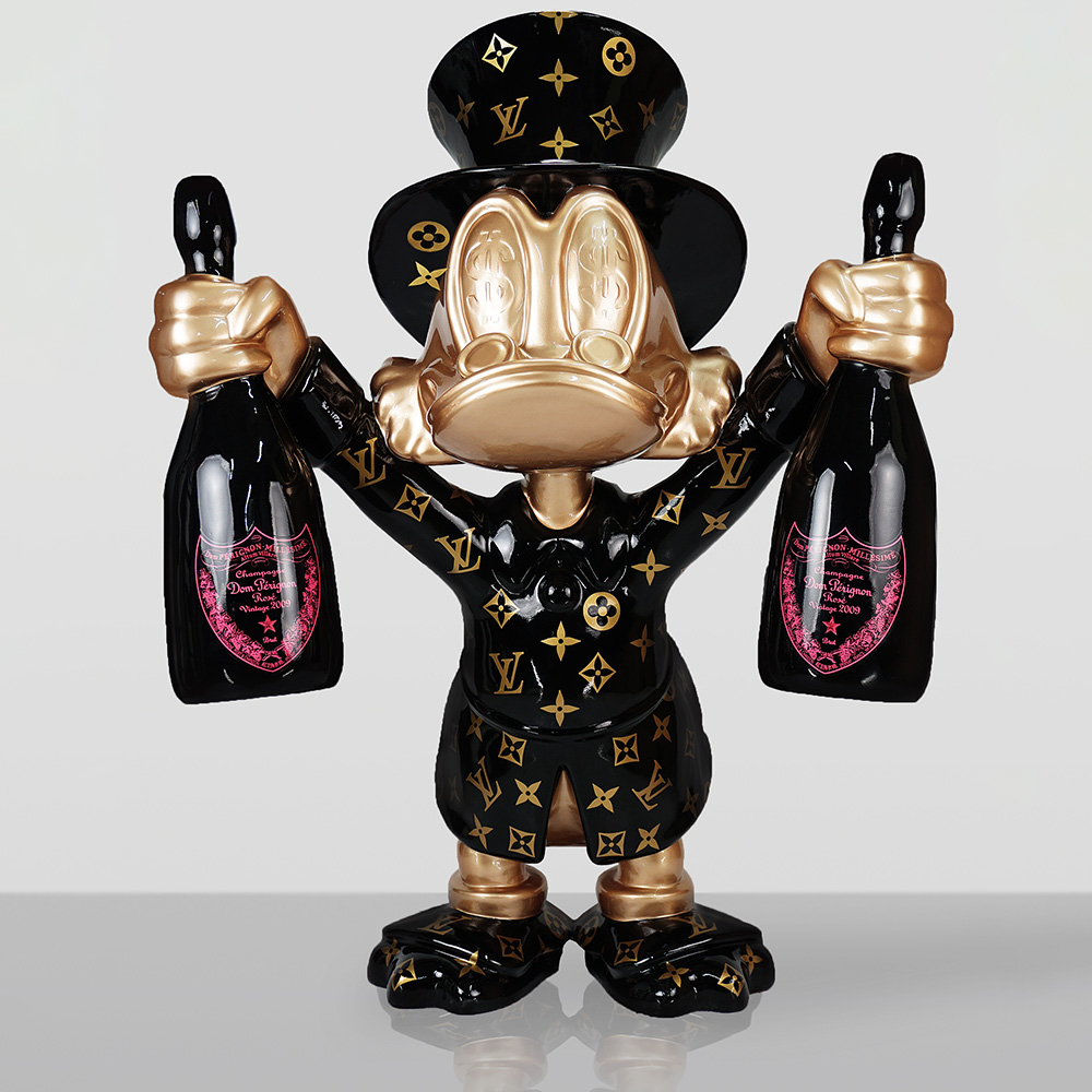 Decorative Figurine – Large Scrooge McDuck 2 Sculpture of a character resembling Donald Duck dressed in a black Louis Vuitton patterned outfit and top hat, with gold face and hands, holding a bottle of Dom Pérignon Rosé champagne in each hand against a plain light gray background.