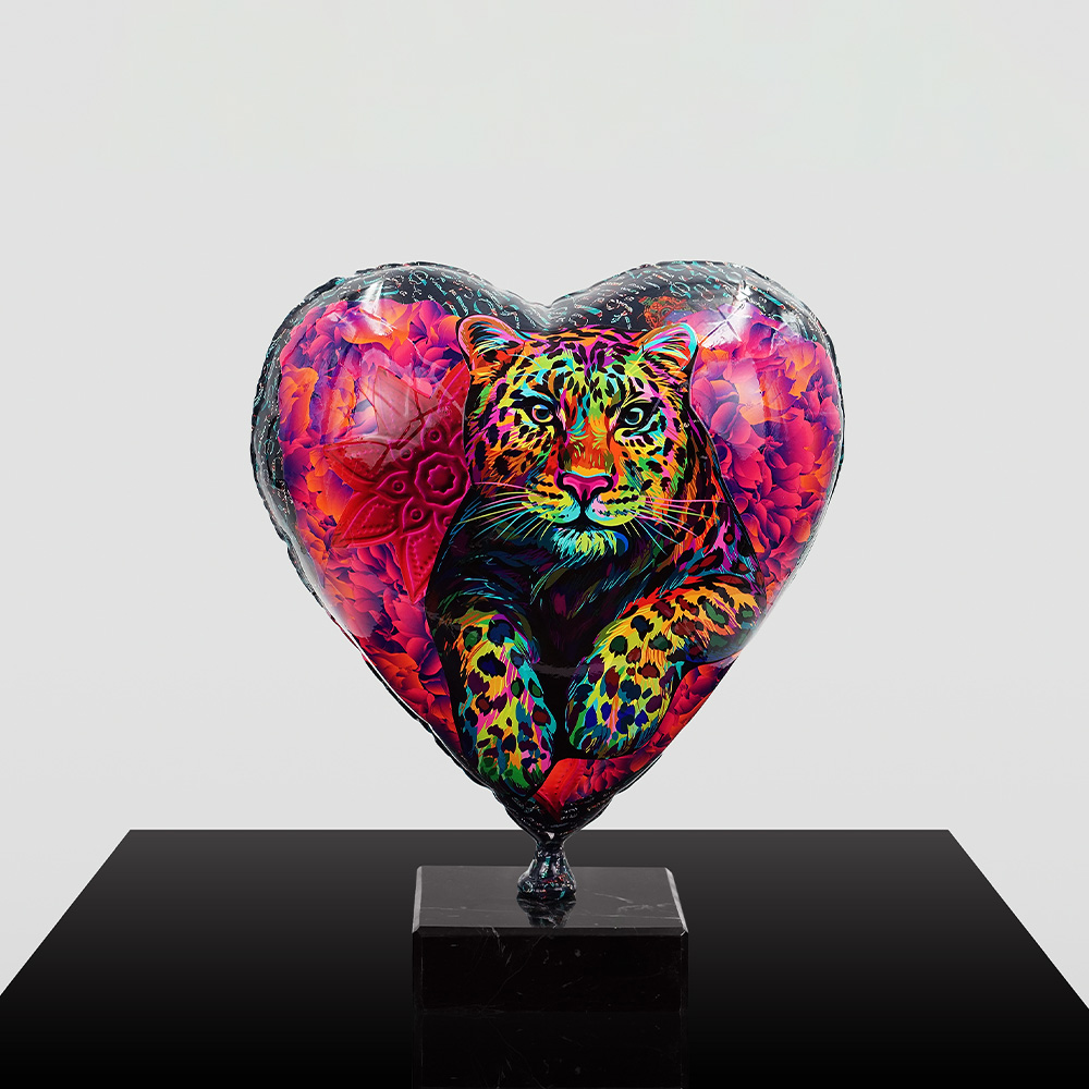 Decorative Heart-Shaped Balloon Figurine 1 Heart-shaped balloon with a vibrant, multicolored leopard illustration against a background of red and purple floral patterns, mounted on a black square base.