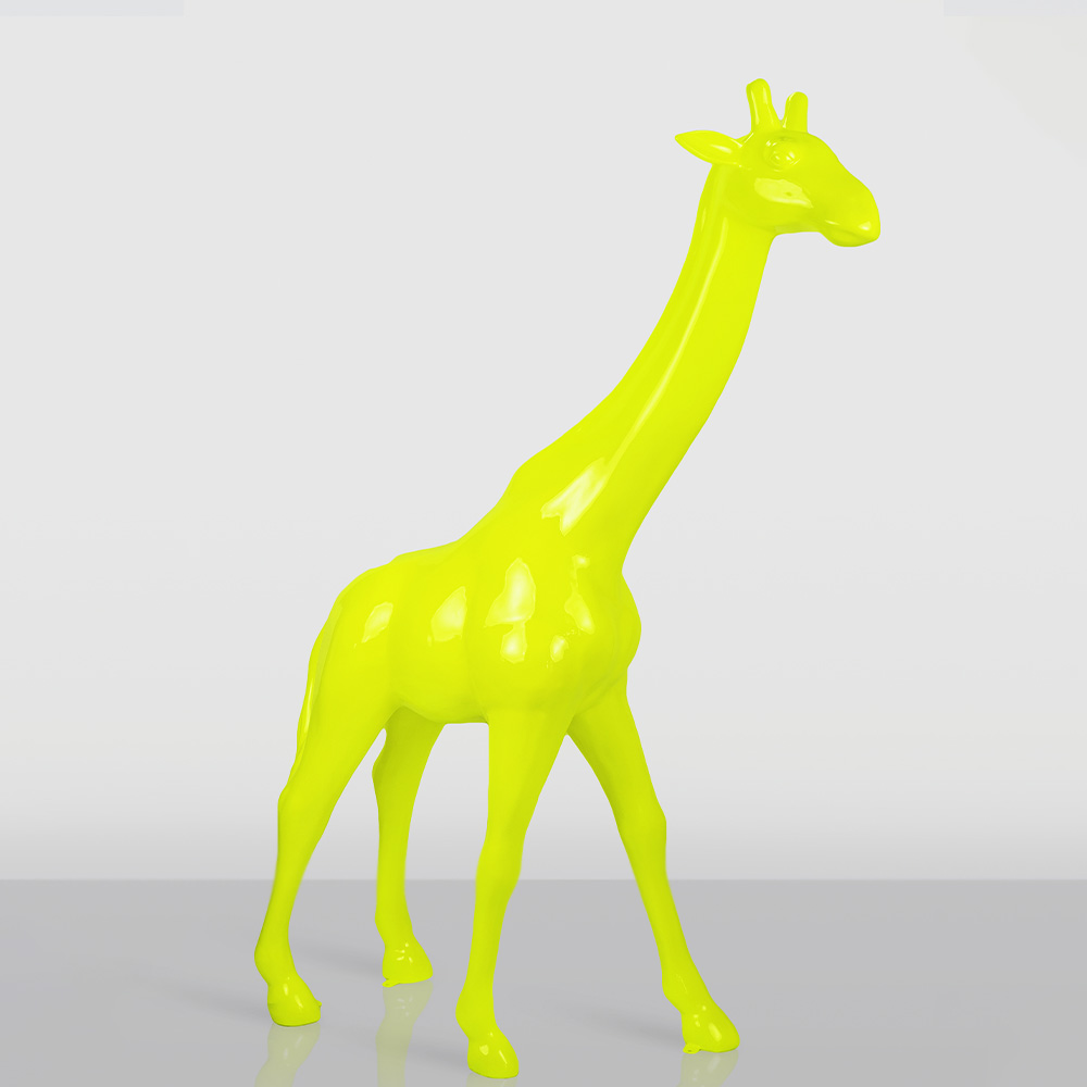 Large Giraffe 230cm – Fluorescent Yellow Version 1 Glossy neon yellow sculpture of a giraffe standing on a reflective surface against a plain light gray background