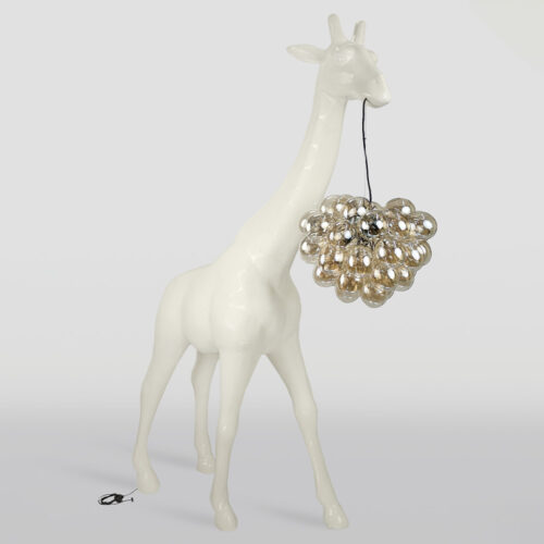 Tall white glossy giraffe sculpture with a cluster of transparent spherical lights hanging from its mouth by a black cord, against a plain light gray background.