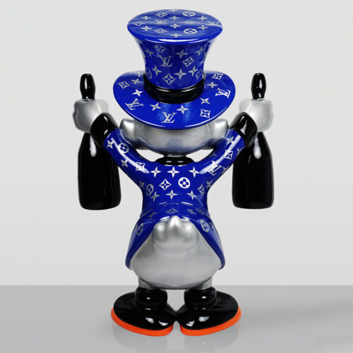 Sculpture of a character with a silver face and tail, wearing a blue Louis Vuitton monogram jacket and top hat, holding two black bottles, viewed from the back.