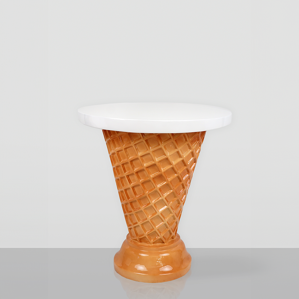 Ice cream shop furniture set – waffle cone table + ice cream chairs 3 A small table with a white round tabletop and a base shaped like an inverted waffle cone with a glossy light brown finish, resembling an ice cream cone.